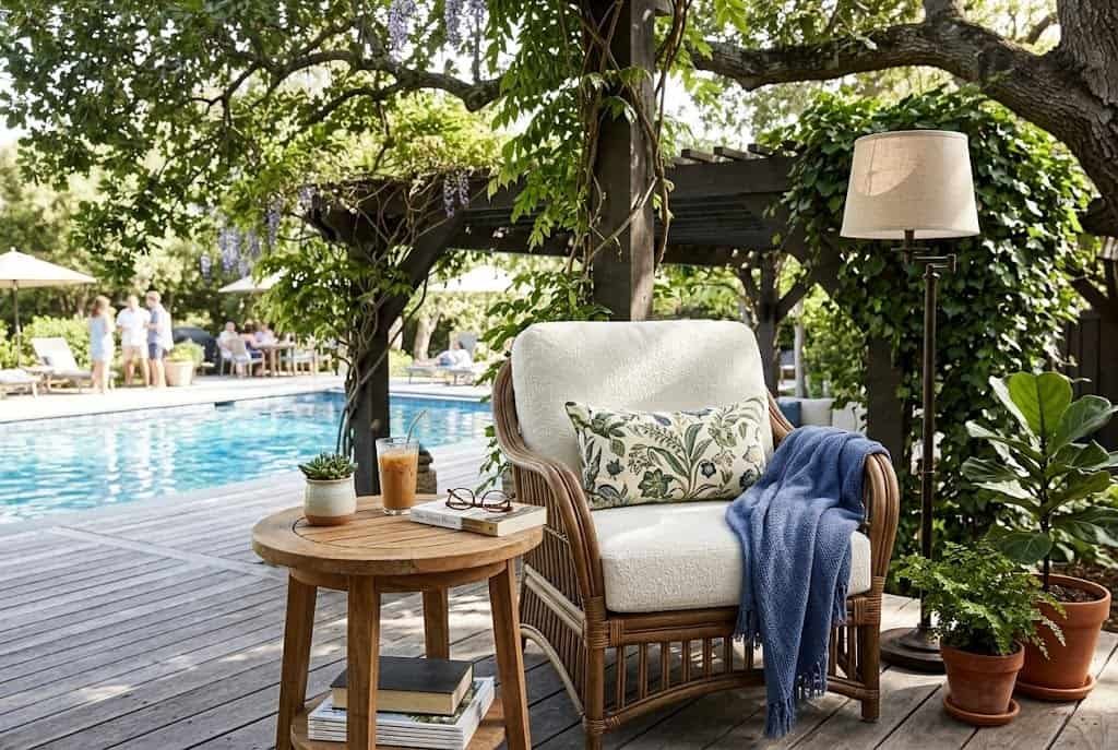 shaded reading nook on pool deck with comfortable chair and side table